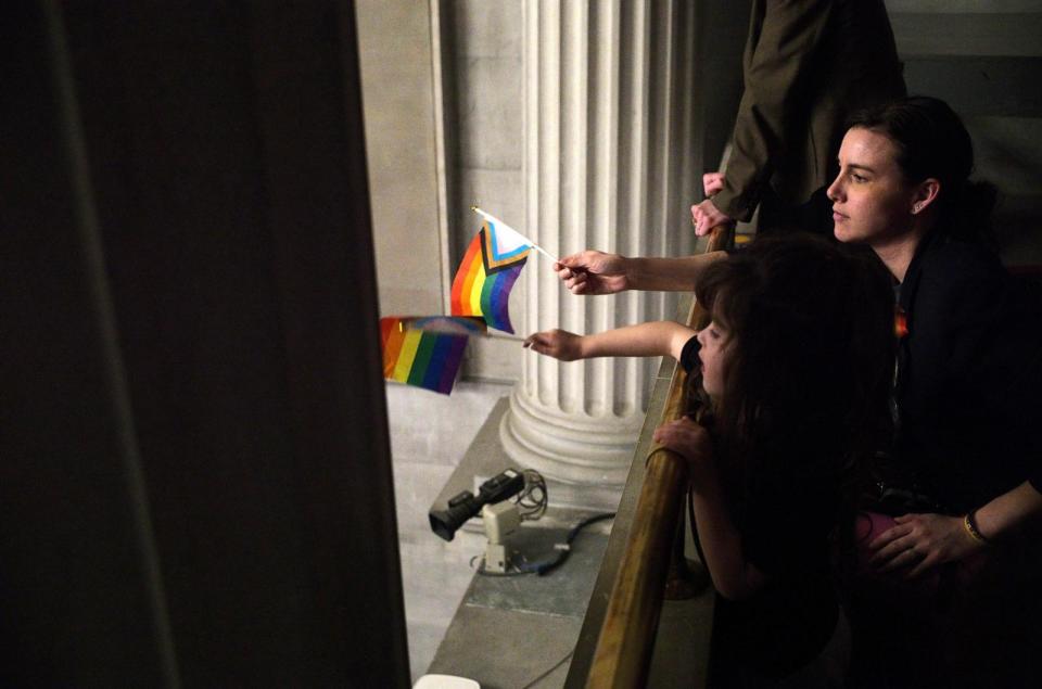 PHOTO: In this Feb. 26, 2024, file photo, a woman and her daughter wave Pride flags from the East Balcony of the Tennessee House during debate of HB 1605, banning pride flags in Tennessee Public Schools, at the Tennessee State Capitol in Nashville, Tenn. (Ray Di Pietro/Shutterstock, FILE)