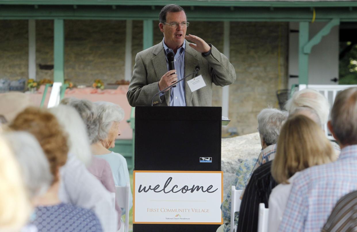 Mark Ricketts, President & CEO of National Church Residences, speaks during the ice house project celebration at First Community Village on July 12.