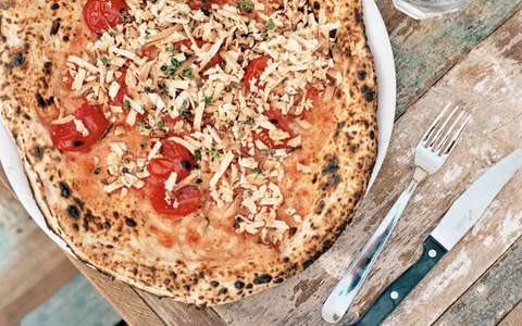 Pizza with tomato, nepetella and baked ricotta - Credit: Jasper Fry