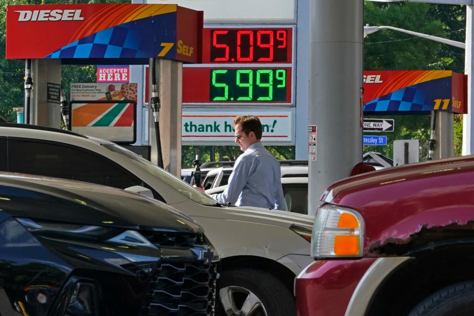 FILE - A man pumps gas at a mini-mart in Pittsburgh on June 15, 2022. As the challenges confronting President Joe Biden intensify, his predictions of a rosy political future for the Democratic Party are growing bolder. The assessments, delivered in speeches, fundraisers and conversations with friends and allies, seem at odds with a country that he acknowledged this week was “really, really down,” burdened by a pandemic, surging gas prices and spiking inflation. (AP Photo/Gene J. Puskar, File) ORG XMIT: WX202