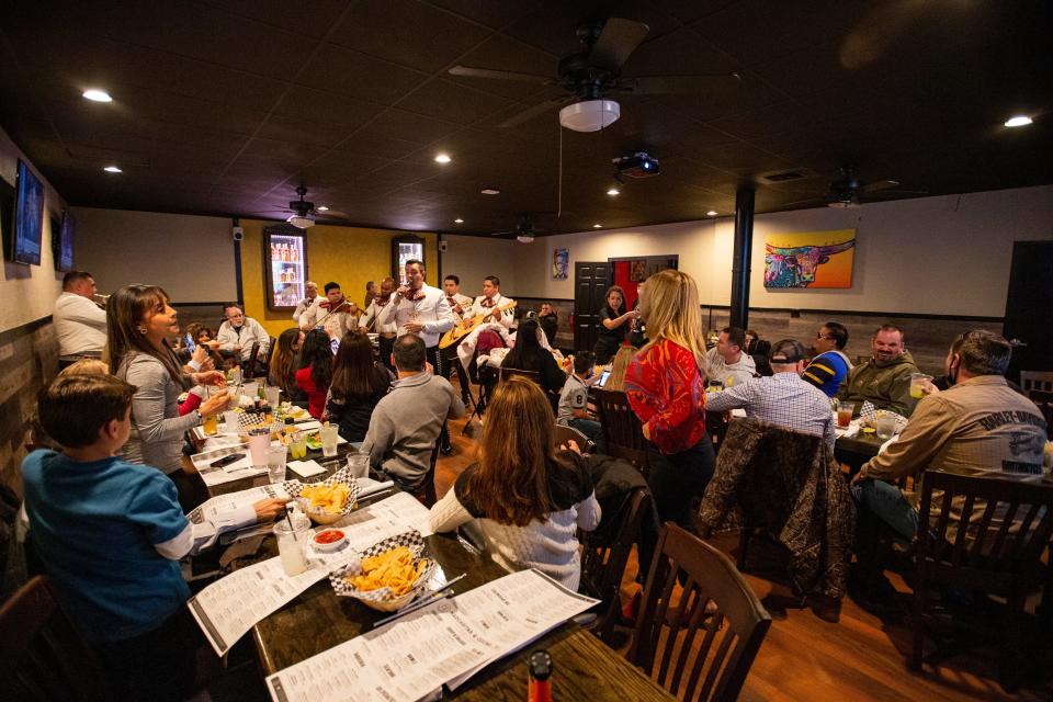 A mariachi band serenades several tables of guests at Casa Grande Margaritas and Cocinero during the grand opening event Wednesday, March 3, 2021. 