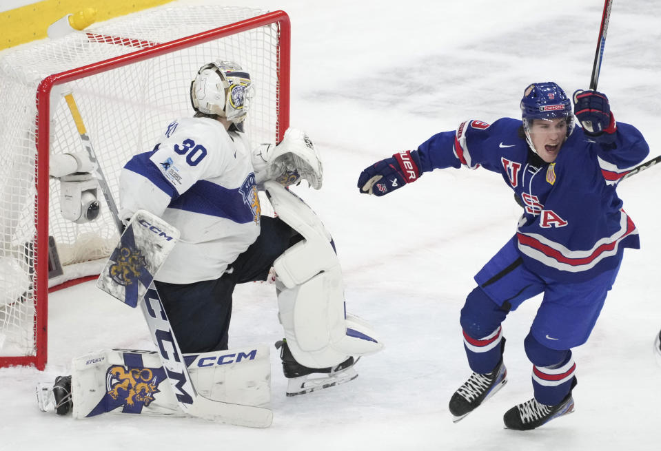 Team USA's Ryan Leonard (9) celebrates a goal by teammate Jimmy Snuggerud (not shown) in front of Finland's goaltender Niklas Kokko (30) during the second period of a semifinal hockey game at the IIHF World Junior Hockey Championship in Gothenburg, Sweden, Thursday Jan. 4, 2024. (Christinne Muschi/The Canadian Press via AP)