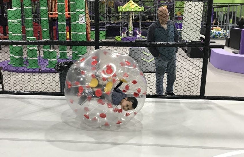 Mulcahey Elementary School second grader Maxwell Derewiany, 7, enjoys a plastic ball ride in a bumper ball court during a visit to Fun City Adventure Park with his grandfather Kevin Cotter on Tuesday, Jan. 10, 2023.