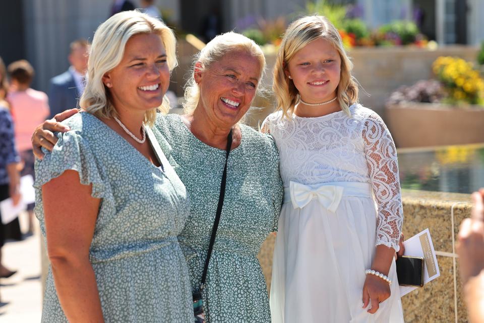 Chelsea Smith, Greta Smith and Marley Smith pose for photos after the first session of the dedication of the Saratoga Springs Utah Temple in Saratoga Springs, Utah, on Sunday, Aug. 13, 2023. | Scott G Winterton, Deseret News