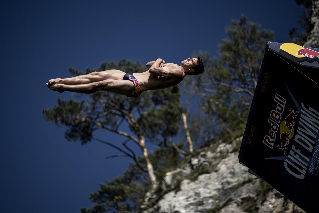 Aidan Heslop of the UK dives from the 27 metre platform during the final competition day of the sixth stop of the Red Bull Cliff Diving World Series in Sisikon, Switzerland on September 11, 2022.