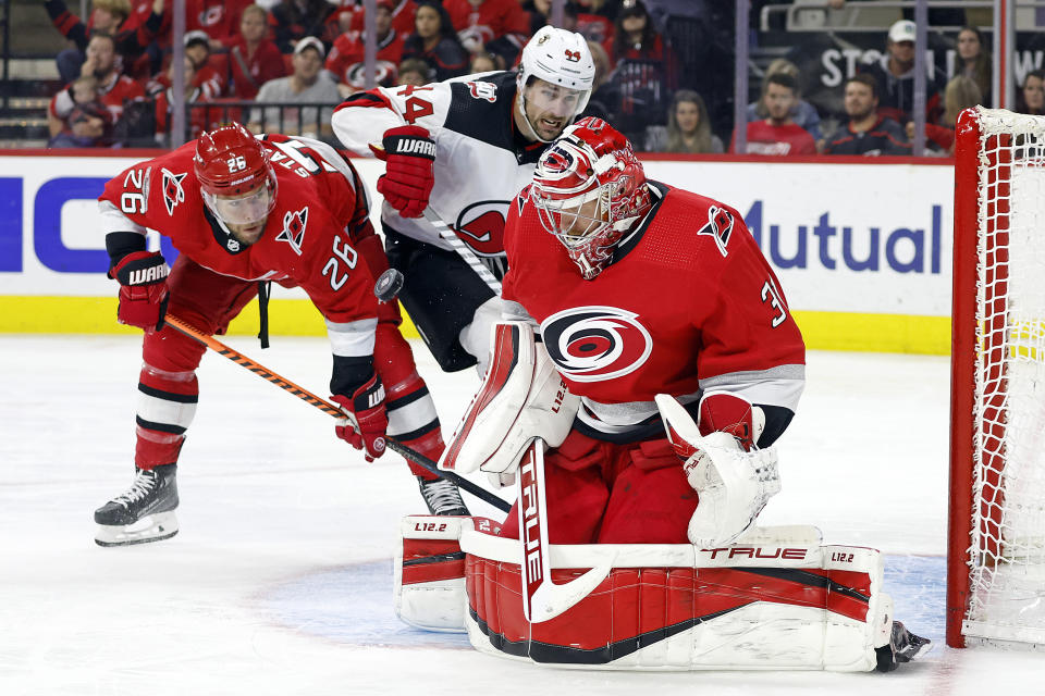 Carolina Hurricanes goaltender Frederik Andersen (31) blocks a New Jersey Devils in front of Carolina Hurricanes' Paul Stastny (26) and Devils' Miles Wood (44) during the third period of Game 5 of an NHL hockey Stanley Cup second-round playoff series in Raleigh, N.C., Thursday, May 11, 2023. (AP Photo/Karl B DeBlaker)