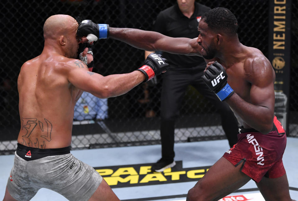 LAS VEGAS, NEVADA - AUGUST 29: In this handout image provided by UFC, (R-L) Neil Magny punches Robbie Lawler in their welterweight fight during the UFC Fight Night event at UFC APEX on August 29, 2020 in Las Vegas, Nevada. (Photo by Jeff Bottari/Zuffa LLC via Getty Images)