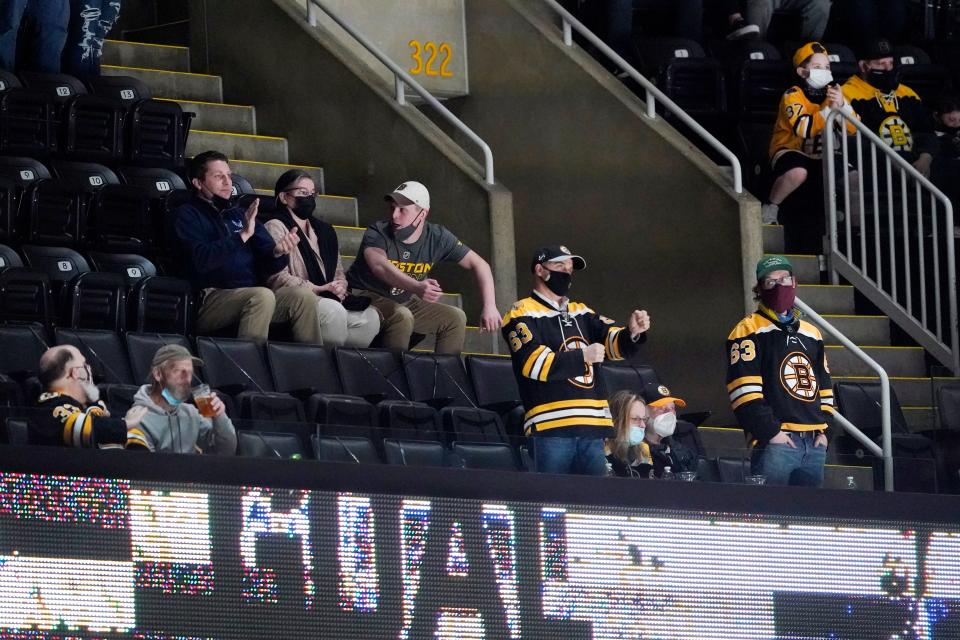 Fans cheer during the second period of an NHL hockey game between the Boston Bruins and the New York Islanders on May 10, 2021, at TD Garden in Boston.