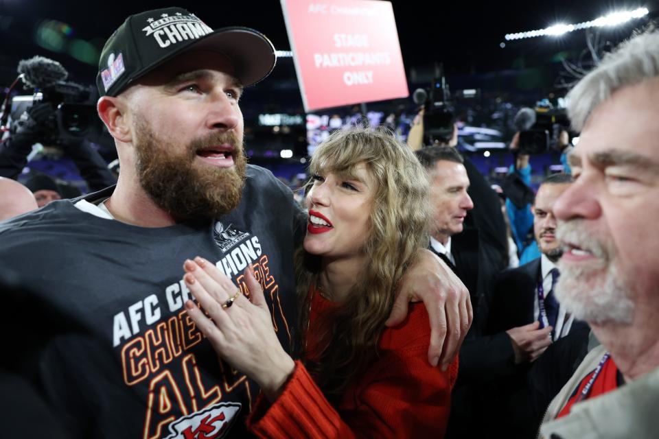 Travis Kelce and Taylor Swift celebrate after Kansas City beat the Baltimore Ravens in the AFC championship game.