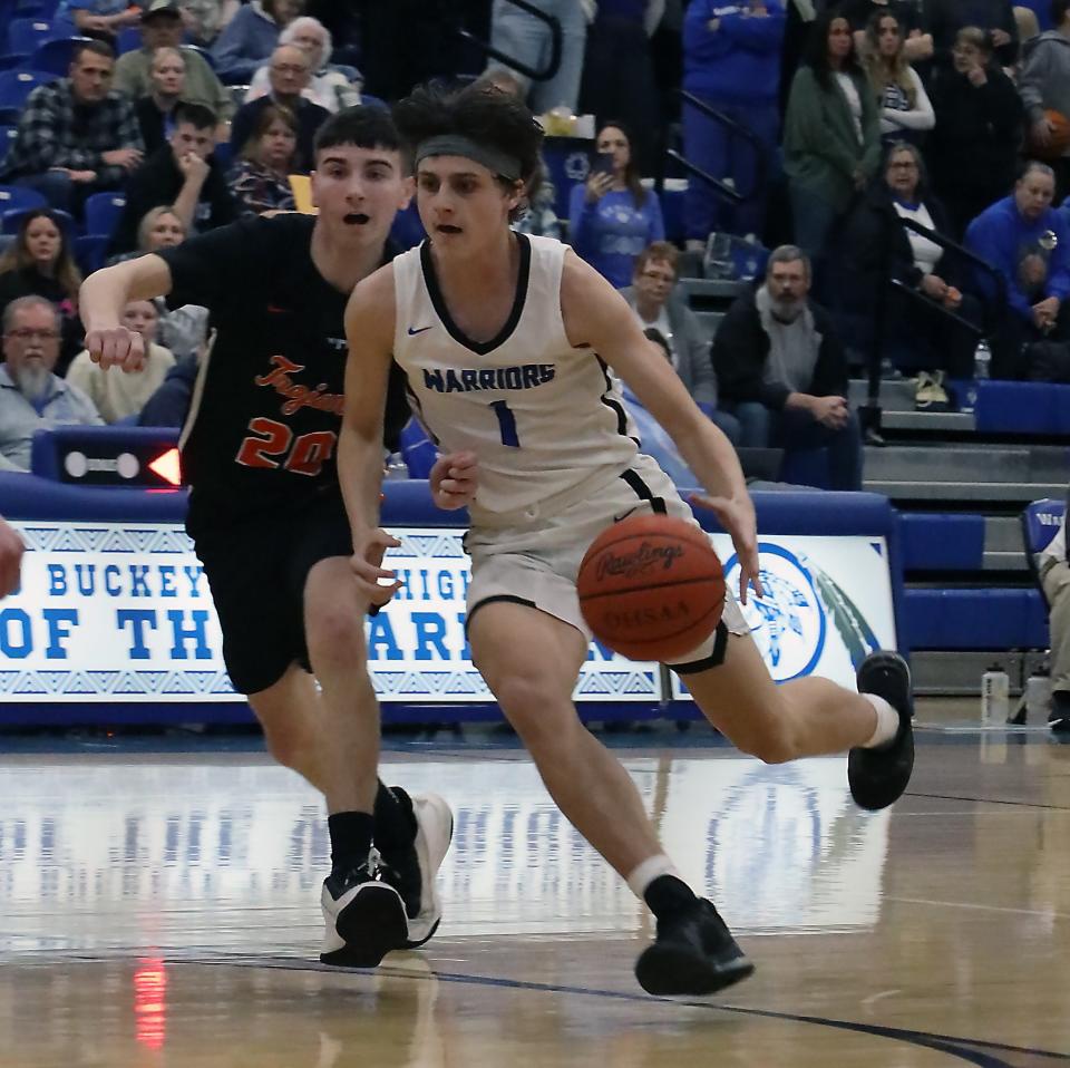 Buckeye Trail's Gavin Rome (1) dribbles the ball during the basketball game against Newcomerstown Tuesday evening at Buckeye Trail High School.