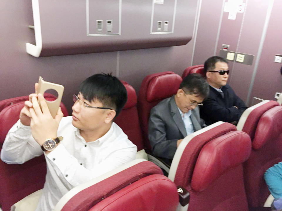 Passengers believed to be North Koreans including Kim Uk Il (L) are seen inside an airplane for the flight bound for Beijing, at an airport in Kuala Lumpur in Malaysia, in this photo taken by Kyodo March 30, 2017. Mandatory credit Kyodo/via REUTERS ATTENTION EDITORS - THIS IMAGE WAS PROVIDED BY A THIRD PARTY. EDITORIAL USE ONLY. MANDATORY CREDIT. JAPAN OUT. NO COMMERCIAL OR EDITORIAL SALES IN JAPAN. TPX IMAGES OF THE DAY