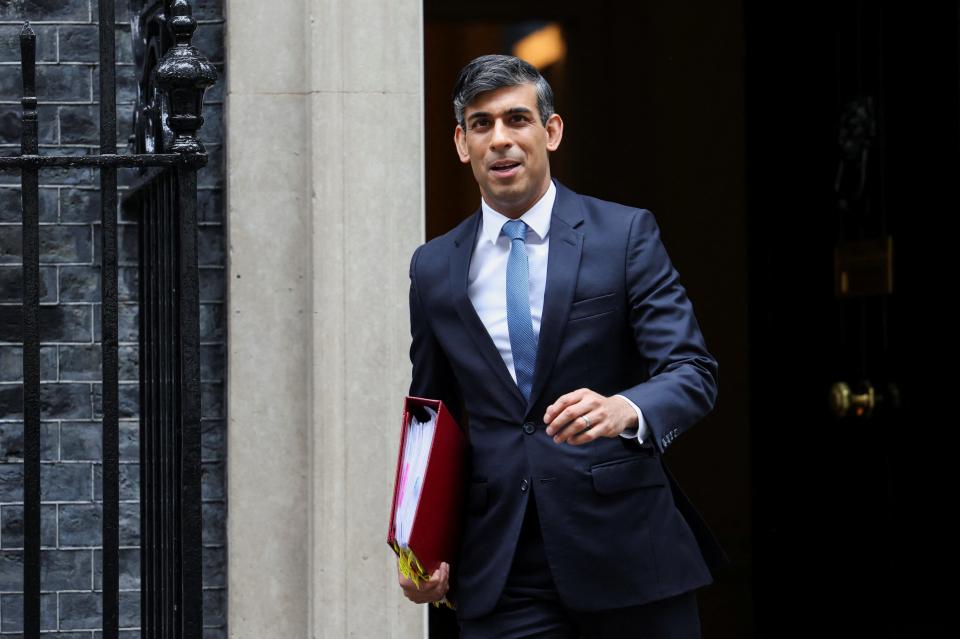 Rishi Sunak outside Downing Street earlier today (REUTERS)