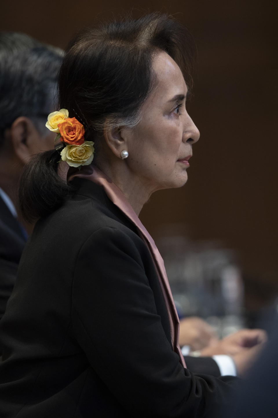 Myanmar's leader Aung San Suu Kyi sits in the court room of the International Court of Justice for the first day of three days of hearings in The Hague, Netherlands, Tuesday, Dec. 10, 2019. Aung San Suu Kyi will represent Myanmar in a case filed by Gambia at the ICJ, the United Nations' highest court, accusing Myanmar of genocide in its campaign against the Rohingya Muslim minority. (AP Photo/Peter Dejong)