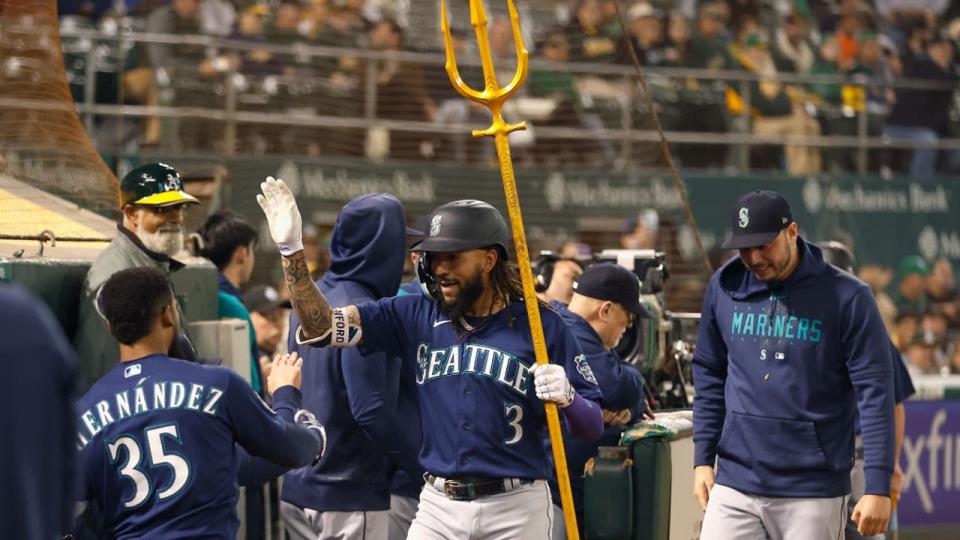 <div>OAKLAND, CALIFORNIA - SEPTEMBER 19: J.P. Crawford #3 of the Seattle Mariners holds a trident while celebrating a solo home run in the top of the ninth inning against the Oakland Athletics at RingCentral Coliseum on September 19, 2023 in Oakland, California. (Photo by Lachlan Cunningham/Getty Images)</div>