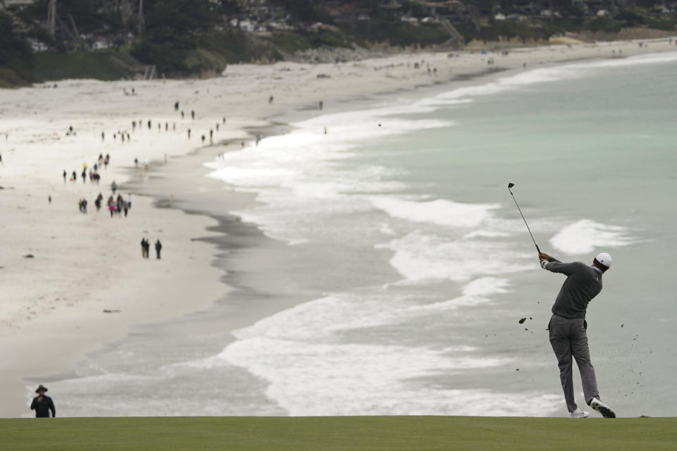 Tiger Woods hits from the fairway on the ninth hole during the third round of the U.S. Open Championship golf tournament, Saturday, June 15, 2019, in Pebble Beach, Calif. (AP Photo/Carolyn Kaster)