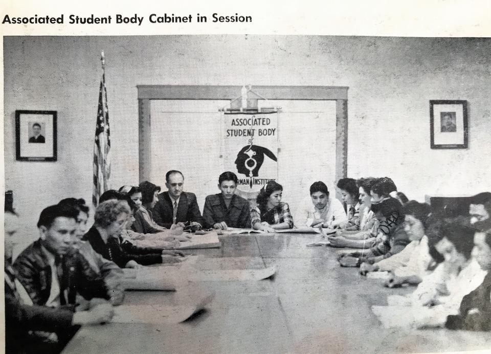 The 1948 yearbook for Sherman Indian High School shows April Carmelo's father, Daniel Carmelo (Dad written over face), in a photo titled "Associated Student Body Cabinet in Session."