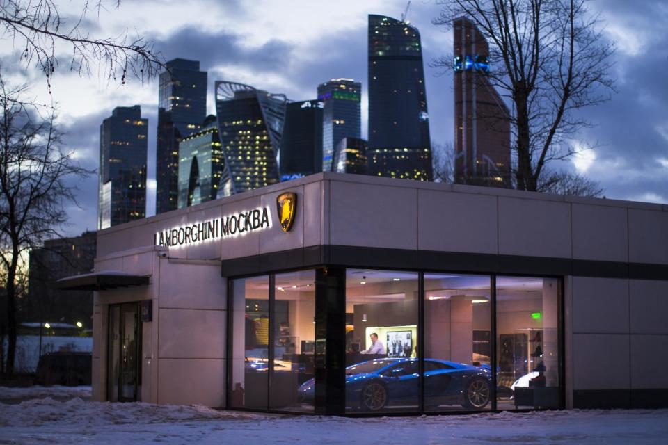 In this photo taken on Wednesday, Feb. 15, 2017, a Lamborghini dealership in Moscow displays luxury sports cars in Moscow, Russia For an Associated Press correspondent returning to the Russian capital on an extended assignment for the first time since the early 1990s, the city holds many new landmarks, but some sights remain unchanged as well. (AP Photo/Alexander Zemlianichenko)