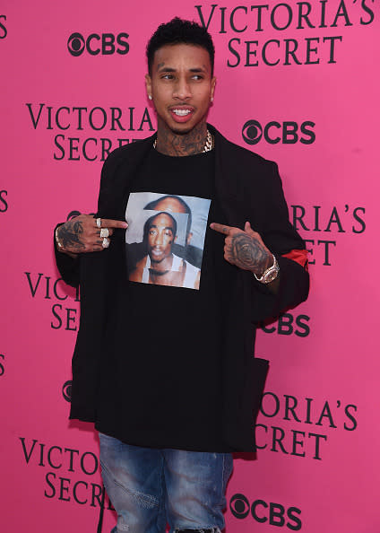 Tyga drew attention to his T-shirt on the pink carpet at the 2015 Victoria’s Secret Fashion Show after party. 