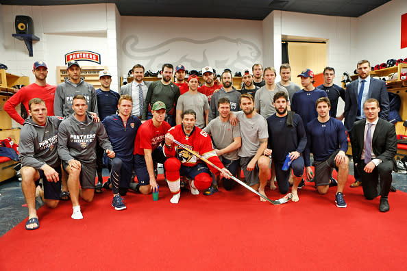 SUNRISE, FL - DECEMBER 22: Jaromir Jagr #68 of the Florida Panthers poses with teammates and a golden hockey stick awarded to him after scoring his 1,888 point in the NHL. Jagr took sole possession of 2nd place in all time points in the NHL passing Mark Messier. The Panthers played the Boston Bruins at the BB&T Center on December 22, 2016 in Sunrise, Florida. (Photo by Joel Auerbach/Getty Images)