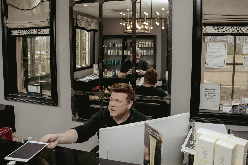Kelly McDaniel works the front desk at a hair salon in Olive Branch, Miss., a suburb of Memphis.<span class="copyright">Andrea Morales for TIME</span>