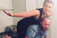 The TV star shows her hairstylist Ryan Randall the secret of burning calories while eating donuts – by climbing on his back and making him lift her.