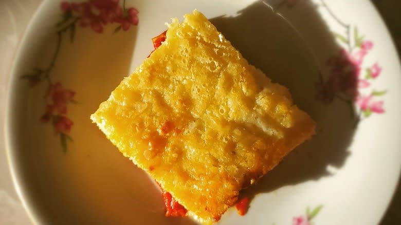 Yellow cake on white plate