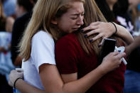 <p>Students mourn during a candlelight vigil for victims of yesterday’s shooting at nearby Marjory Stoneman Douglas High School, in Parkland, Fla., Feb. 15, 2018. (Photo: Carlos Garcia Rawlins/Reuters) </p>