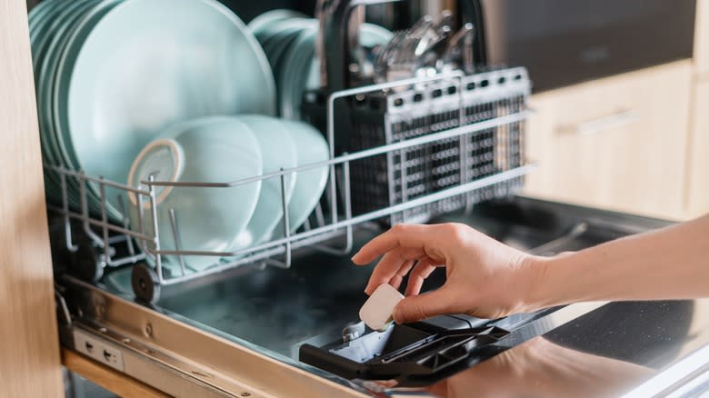 Putting dishwasher pod in