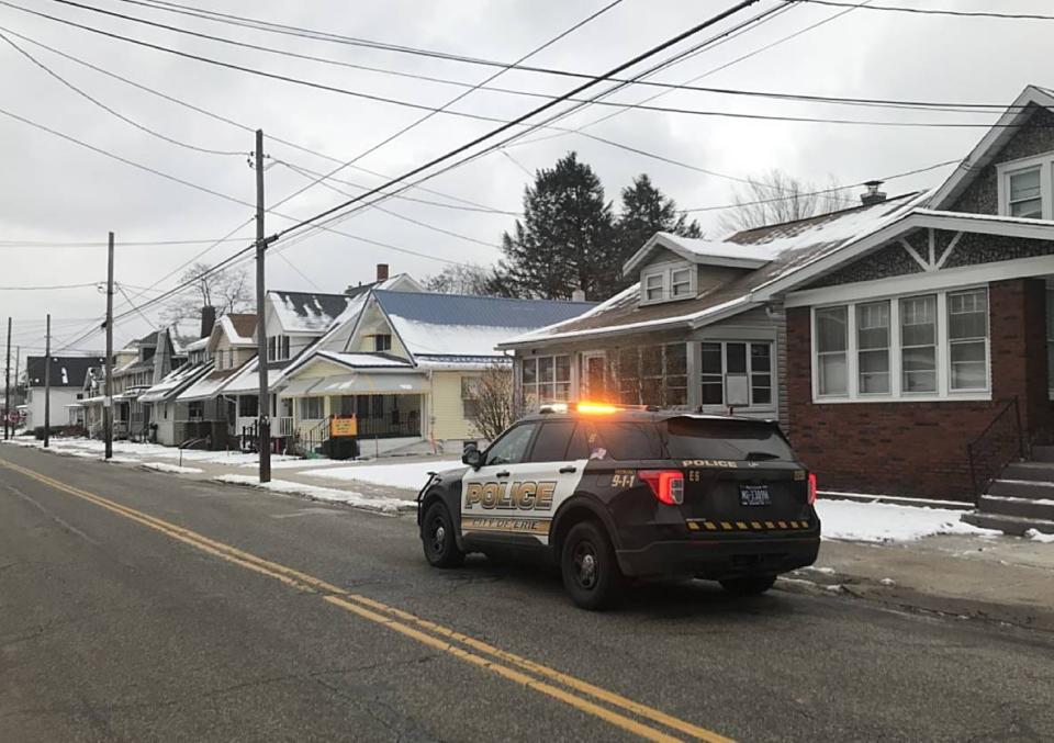 Erie police hold a residence in the 900 block of East 28th Street as a crime scene on Tuesday after two people were killed in a suspected murder-suicide there on Monday night.