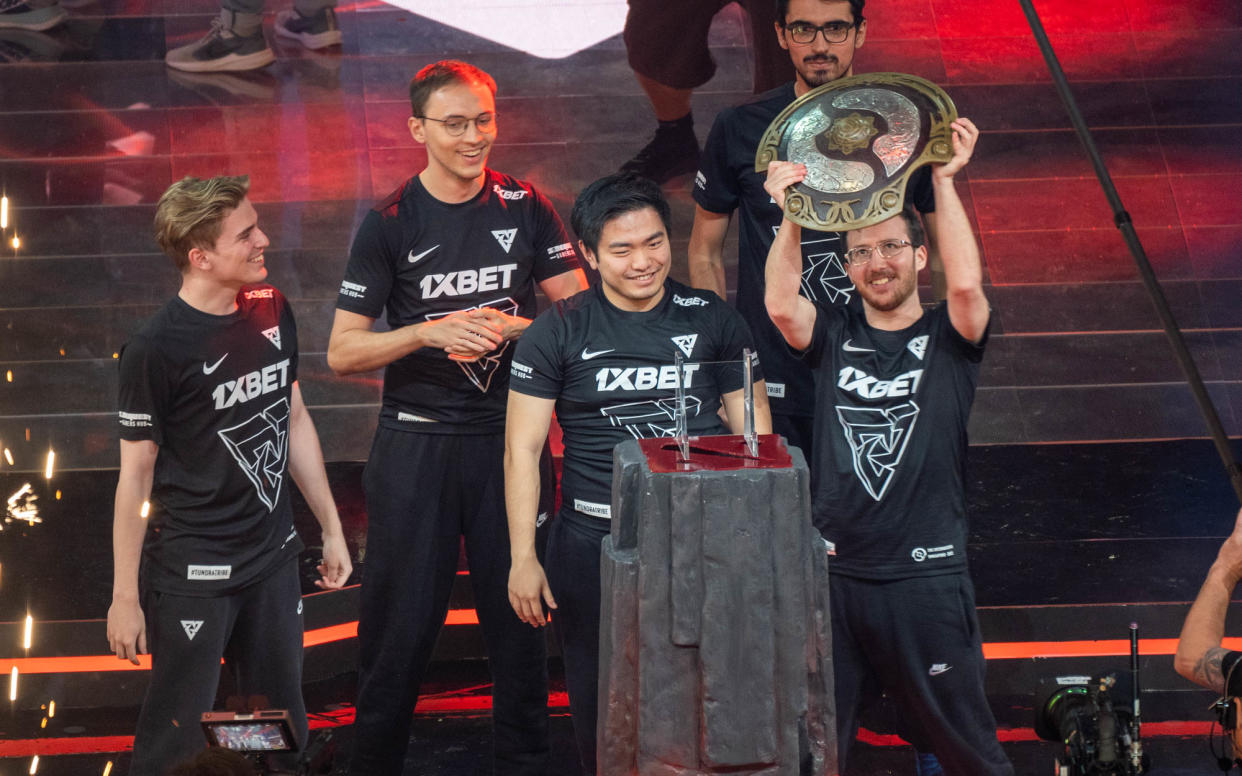 Tundra player 33 lifting the Aegis with the team around him