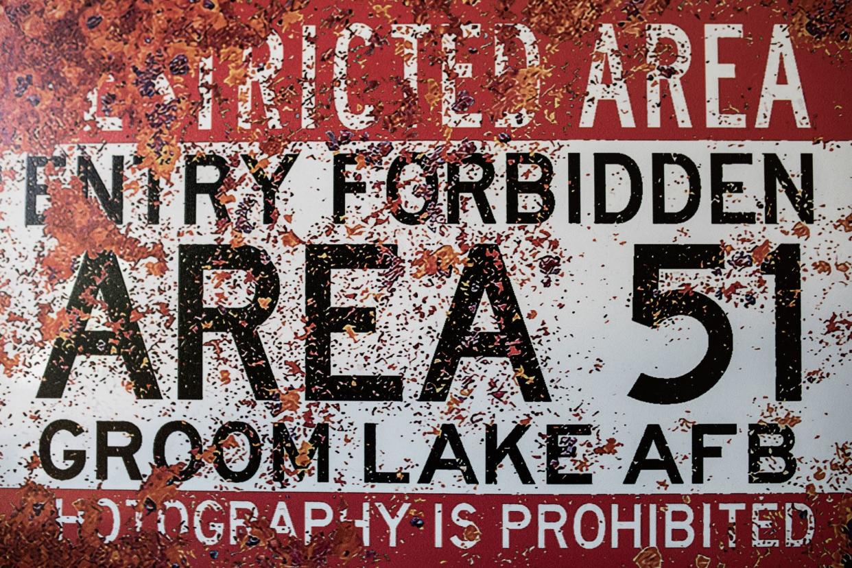 An old rusted looking Area 51 warning sign.