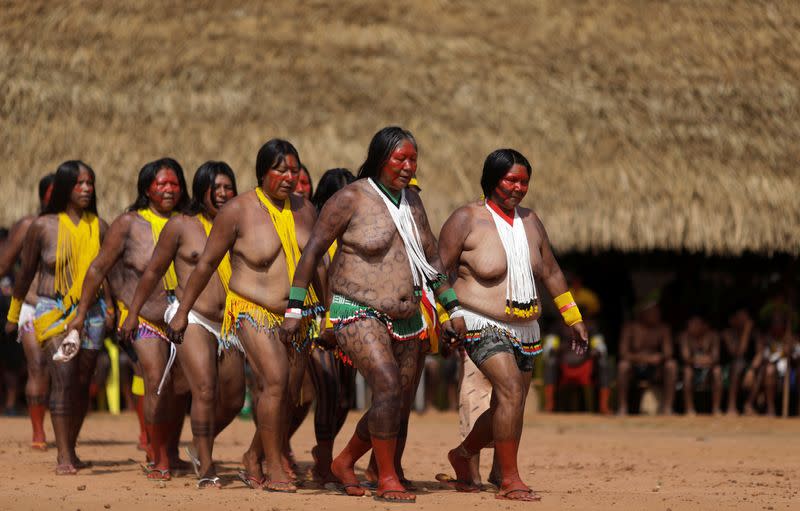 Indigenous woman of Kayapo tribe sing and dance during a four-day pow wow in Piaracu village near Sao Jose do Xingu