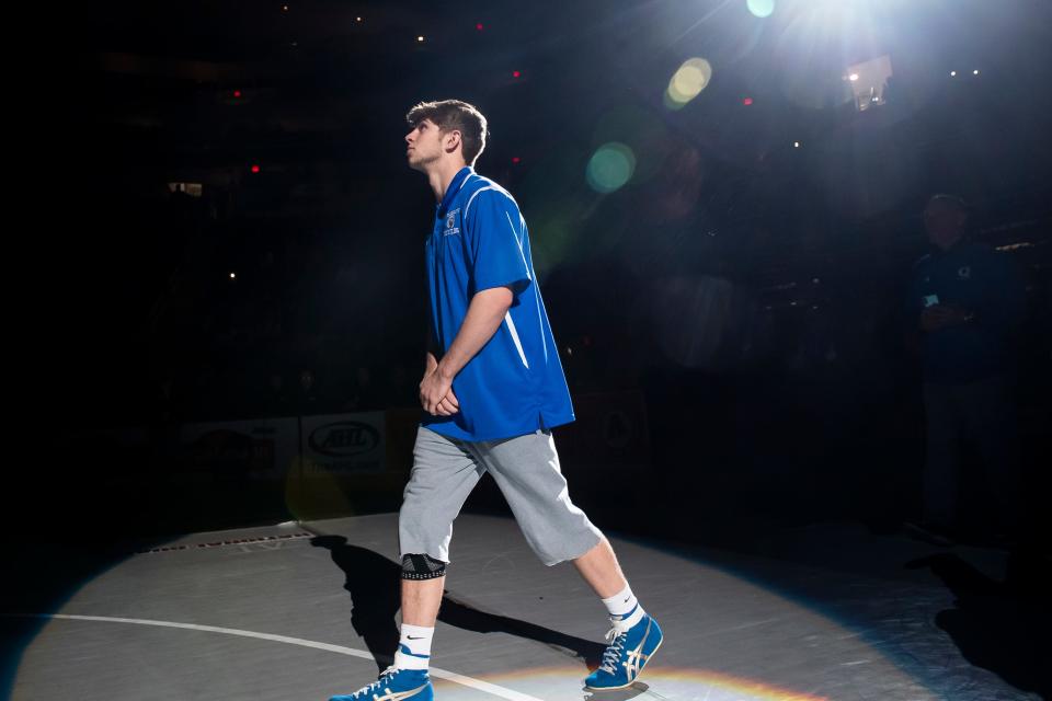 Quakertown's Collin Gaj walks out during the Parade of Champions before winning the 145-pound PIAA Class 3A title last season in Hershey.