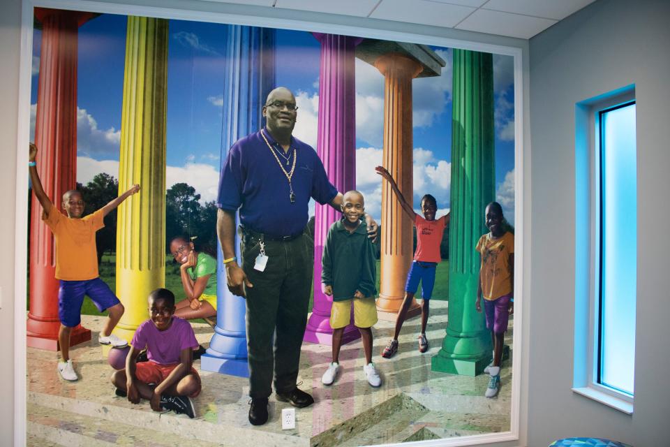 A mural of the late Clarence R. Kelly sits on a wall inside the newly rebuilt Clarence R. Kelly Community Center and Park on Northeast Eighth Avenue in Gainesville on June 19. (Lawren Simmons/Special to The Guardian)