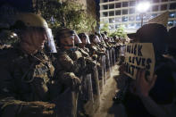 Utah National Guard soldiers line the street as demonstrators gather to protest the death of George Floyd, Wednesday, June 3, 2020, near the White House in Washington. Floyd died after being restrained by Minneapolis police officers. (AP Photo/Alex Brandon)