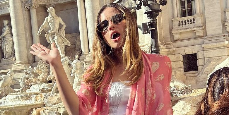 addison rae channels lizzie mcguire in a y2k top and jeans at the trevi fountain, rome