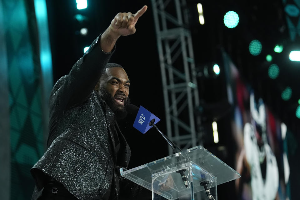 Brandon Graham of the Philadelphia Eagles announces a pick for the Philadelphia Eagles during the second night of the NFL football draft, Friday, April 26, 2024, in Detroit. (AP Photo/Jeff Roberson)