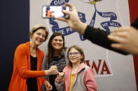 Democratic presidential candidate Sen. Elizabeth Warren, D-Mass., left, poses for a photo with attendees after speaking at a campaign event, Sunday, Jan. 12, 2020, in Marshalltown, Iowa. (AP Photo/Patrick Semansky)