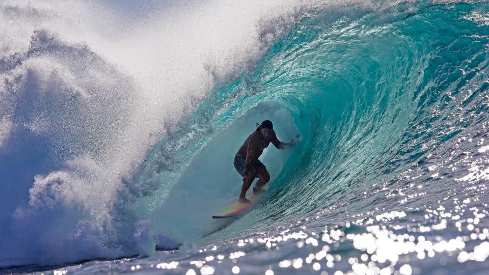 Perry's wife, Emilia Perry, credits him with helping her fine tune her surfing skills. - Brian Bielmann/AFP/Getty Images