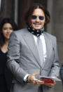 Actor Johnny Depp arrives at the High Court in London, Thursday, July 16, 2020. Depp is suing News Group Newspapers, publisher of The Sun, and the paper’s executive editor, Dan Wootton, over an April 2018 article that called him a “wife-beater.” The Sun’s defense relies on a total of 14 allegations by his ex-wife Amber Heard of Depp’s violence. He strongly denies all of them. (AP Photo/Alastair Grant)