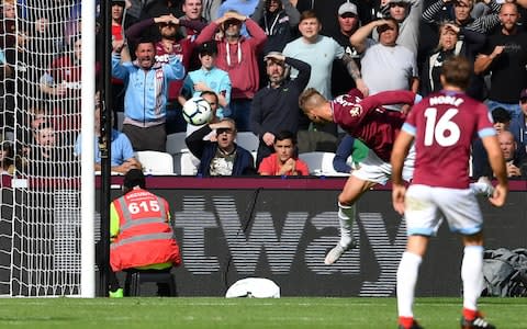 West Ham United's Ukrainian striker Andriy Yarmolenko (C) misses with this header during the English Premier League football match between West Ham United and Chelsea - Credit: Getty images