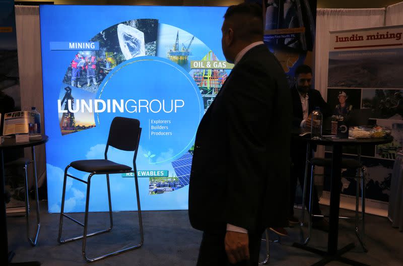 A man passes the Lundin Group mining company booth during the PDAC convention in Toronto