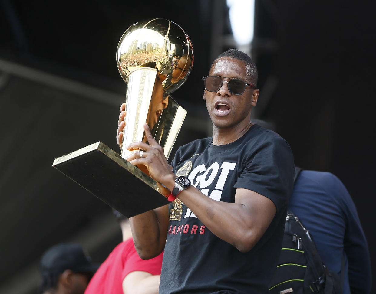 Jun 17, 2019; Toronto, Ontario, Canada; Toronto Raptors president Masai Ujiri holds up the Larry O'Brien championship trophy during a rally at Toronto city hall Nathan Phillips Square. Mandatory Credit: John E. Sokolowski-USA TODAY Sports