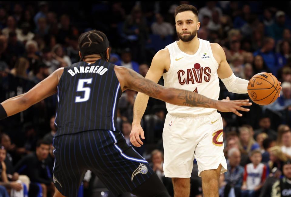 Cavaliers guard Max Strus dribbles as Orlando Magic forward Paolo Banchero defends during the second quarter, Jan. 22, 2024, in Orlando.