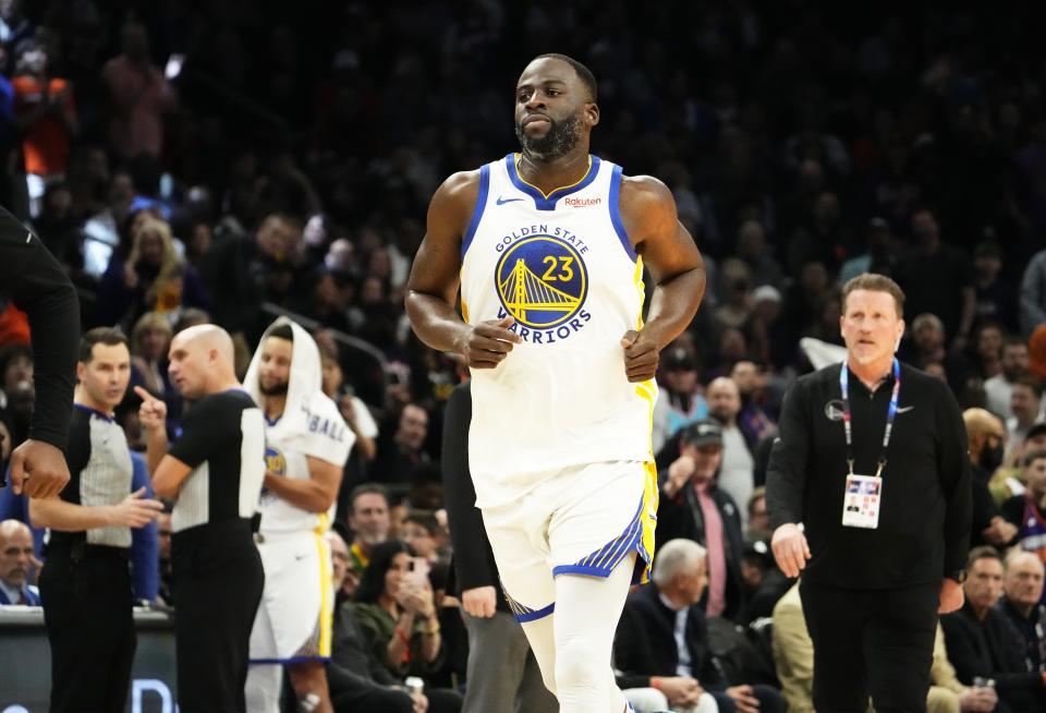 Golden State Warriors forward Draymond Green (23) runs off the court after being ejected from the game after receiving a Flagrant Foul, Penalty 2 for hitting Phoenix Suns center Jusuf Nurkic in the face in the second half at Footprint Center.