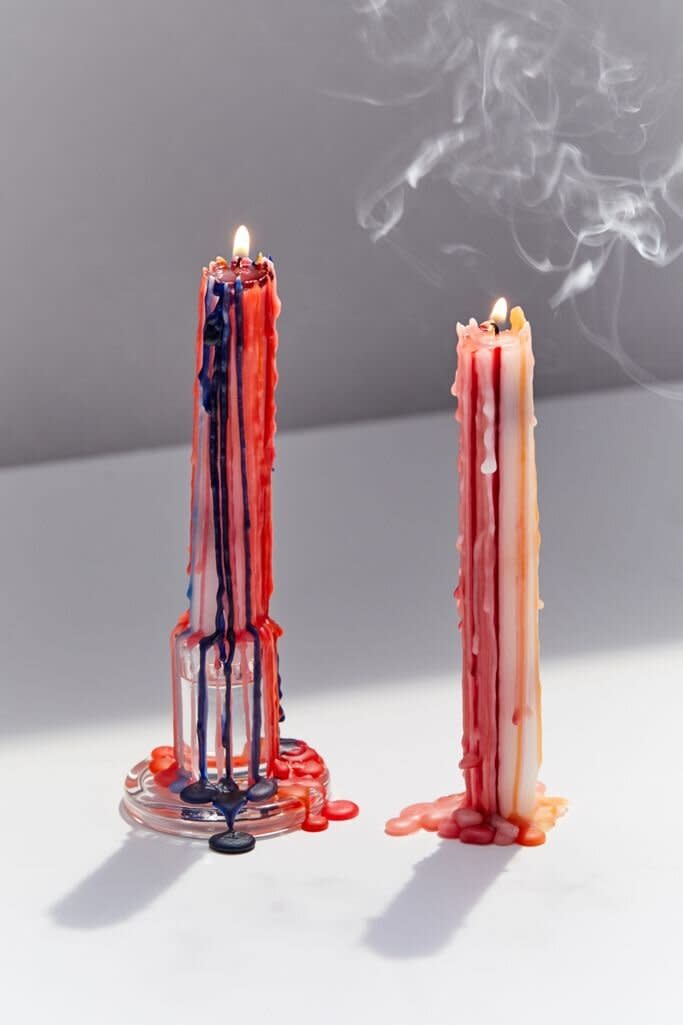 No, your mind isn't playing tricks on you &mdash; this candle is dripping in different colors. <a href="https://fave.co/33gOoR5" target="_blank" rel="noopener noreferrer">Find the set for $4 at Urban Outfitters</a>.
