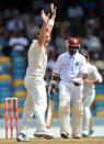 Australian bowler Ryan Harris (L) celebrates dismissing West Indies batsman Narsingh Deonarine (R) during the final day of the first-of-three Test matches between Australia and West Indies at the Kensington Oval stadium in Bridgetown on April 11, 2012. AFP PHOTO/Jewel Samad (Photo credit should read JEWEL SAMAD/AFP/Getty Images)