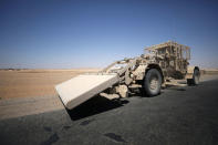 A U.S military demining vehicle is seen on the main road in Raqqa, Syria July 31, 2017. REUTERS/ Rodi Said/Files