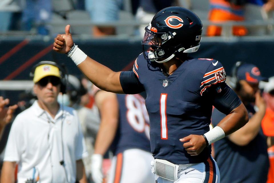 Bears quarterback Justin Fields gives a thumbs up to fans as he runs on the field before Chicago's game against the Bengals at Soldier Field on September 19.