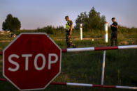 FILE - In this file photo taken on Friday, July 9, 2021, Members of the Lithuania State Border Guard Service patrol on the border with Belarus, near the village of Purvenai, Lithuania. Lithuanian authorities said Friday that the Baltic country has stemmed the flow of third country migrants illegally crossing from neighboring Belarus, saying the influx of people knocking at the external border of European Union seems to have halted and hundreds have been turned away. (AP Photo/Mindaugas Kulbis, File)